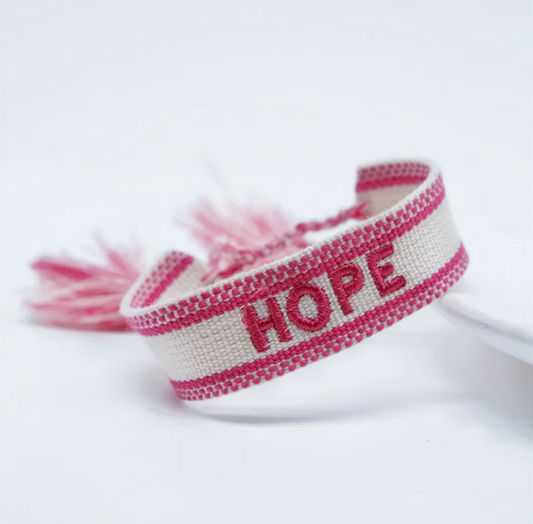 Bracciale in tessuto bianco con scritta "hope" ricamata fucsia